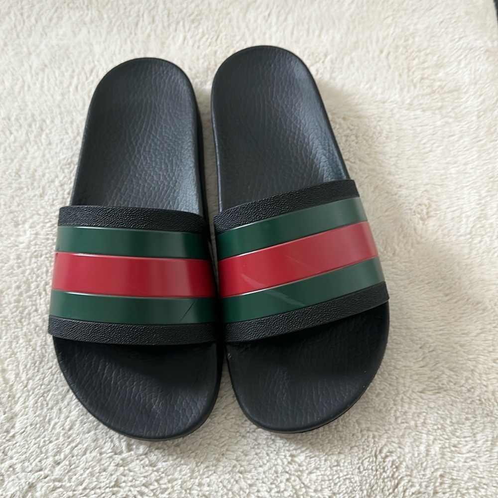 Gucci slides.  They were for my son too small only worn few times